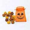 14 αρωματικά Wax Melts Halloween Pumpkin Soufflé σε πορτοκαλί πουγκί με πρόσωπο κολοκύθας